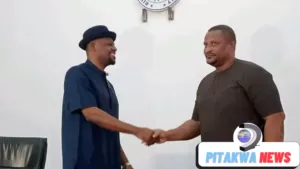 file photo of martins amaewhule shaking hands with the new appointed hon major jack 1_png